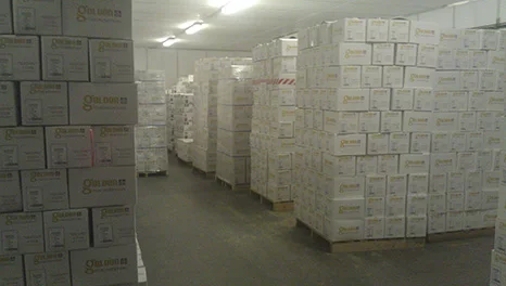 Stacked cartons of product in a warehouse